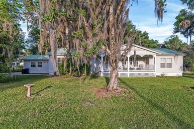 Tucked away among majestic live oaks and native palms, this - photo 5