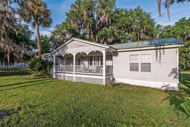 Tucked away among majestic live oaks and native palms, this - photo 6