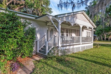 Tucked away among majestic live oaks and native palms, this - photo 8