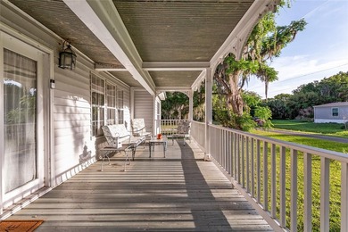 Tucked away among majestic live oaks and native palms, this - photo 9