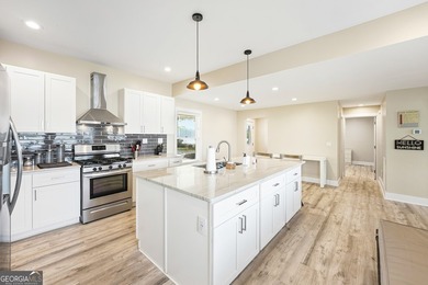 Completely reimagined and beautifully renovated, this Lake - photo 7