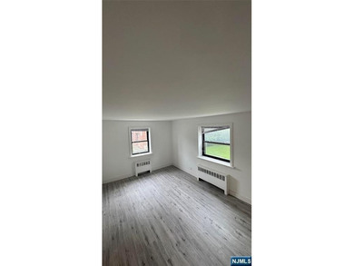 Welcome to Unit A7 at 2335 Hudson Terrace, a renovated 2-bedroom