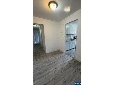 Welcome to Unit A7 at 2335 Hudson Terrace, a renovated 2-bedroom