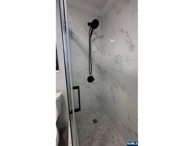 Welcome to Unit A7 at 2335 Hudson Terrace, a renovated 2-bedroom