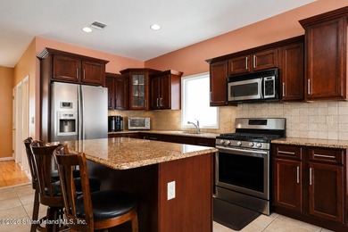This gorgeous 2-family, 4-bedroom, 3-bathroom, side-hall - photo 12