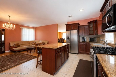 This gorgeous 2-family, 4-bedroom, 3-bathroom, side-hall - photo 13