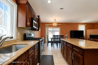 This gorgeous 2-family, 4-bedroom, 3-bathroom, side-hall - photo 18