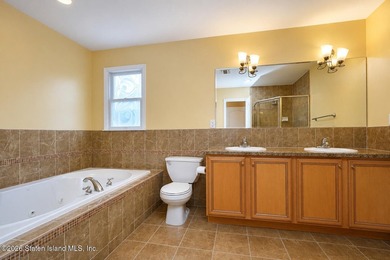 This gorgeous 2-family, 4-bedroom, 3-bathroom, side-hall - photo 24