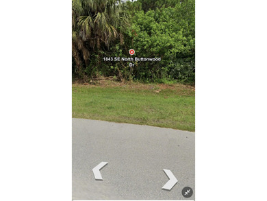 The property at 1843 SE North Buttonwood Drive is located in a - photo 3