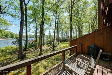 ***LAKEFRONT***AND SLEEPING LOFT. Nestled in the serene and - photo 4