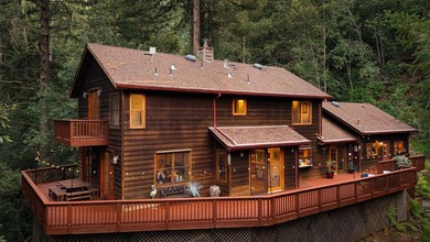 Perched atop a private knoll in the redwoods of the Glenwood - photo 4