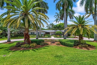 Nestled on a lush builder's acre along a quiet winding street in - photo 1