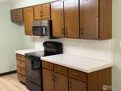 You are home as the easy-care front yard combines a small lawn