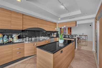 This exceptional 3-bedroom, 4.5-bath sky residence is nestled - photo 1