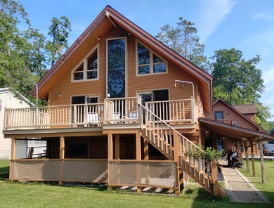 This unique home has incredible, beachfront on scenic Ess Lake - photo 3
