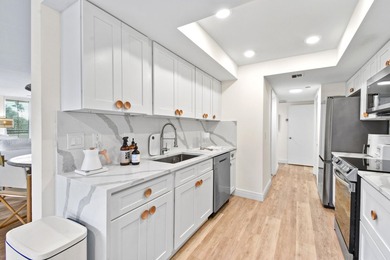 Step into this exquisitely reimagined condo in the prestigious - photo 22