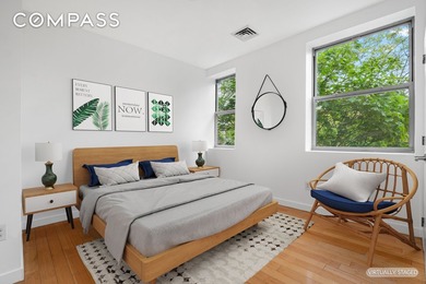 Bright and airy, this three-bedroom, two-bathroom condo is - photo 3