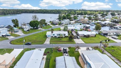 Located in the waterfront community of Sportsman Harbor in - photo 4