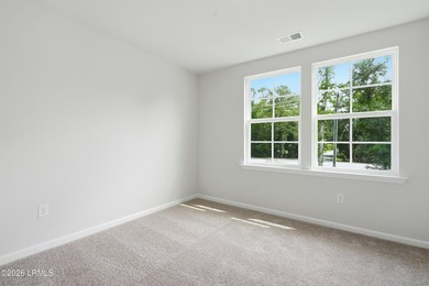 This two-story home includes three bedrooms and two and one-half - photo 20