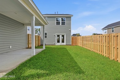 This two-story home includes three bedrooms and two and one-half - photo 26