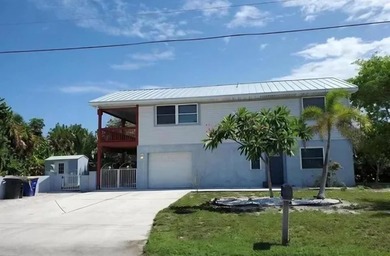 NO HOA. Just two blocks from the Atlantic Ocean. This three - photo 1