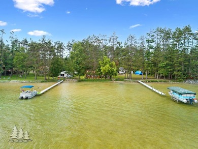 Tucked along 50 feet of coveted West Twin Lake frontage, this - photo 3