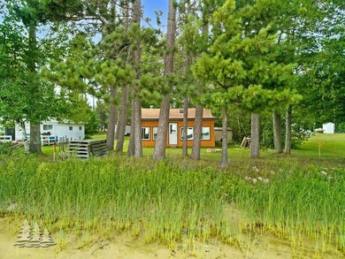 Tucked along 50 feet of coveted West Twin Lake frontage, this - photo 4