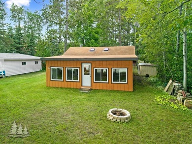 Tucked along 50 feet of coveted West Twin Lake frontage, this - photo 5