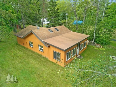 Tucked along 50 feet of coveted West Twin Lake frontage, this - photo 7