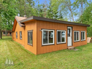 Tucked along 50 feet of coveted West Twin Lake frontage, this - photo 8