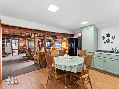 Tucked along 50 feet of coveted West Twin Lake frontage, this - photo 9