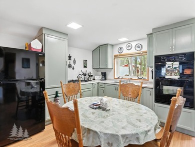 Tucked along 50 feet of coveted West Twin Lake frontage, this - photo 10