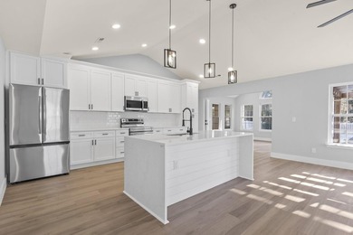 Welcome to this beautifully fully renovated 3 bedrooms, 2 and a - photo 13