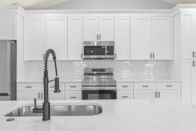 Welcome to this beautifully fully renovated 3 bedrooms, 2 and a - photo 16