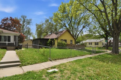 Corner lot home with metal siding and a 2-car garage within - photo 3