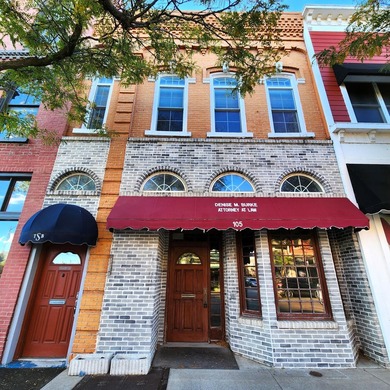 This beautiful downtown building still has original brick work - photo 1