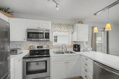 Fully furnished and turnkey, this beautifully maintained coastal - photo 17