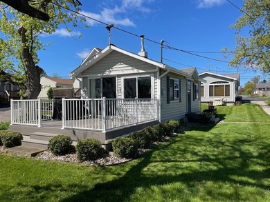 Nestled on the picturesque west shore of Houghton Lake, the - photo 1
