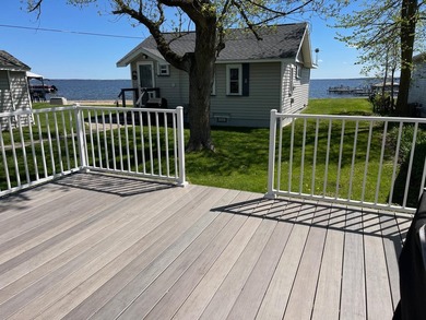Nestled on the picturesque west shore of Houghton Lake, the - photo 3