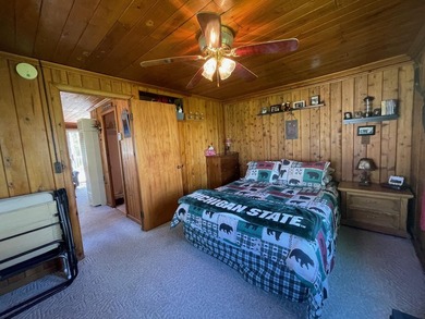 Nestled on the picturesque west shore of Houghton Lake, the - photo 7
