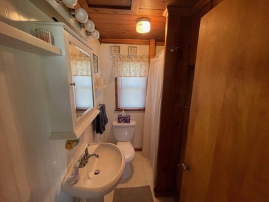 Nestled on the picturesque west shore of Houghton Lake, the - photo 8