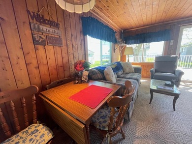 Nestled on the picturesque west shore of Houghton Lake, the - photo 9