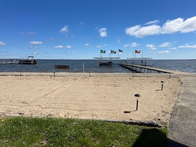 Nestled on the picturesque west shore of Houghton Lake, the - photo 10