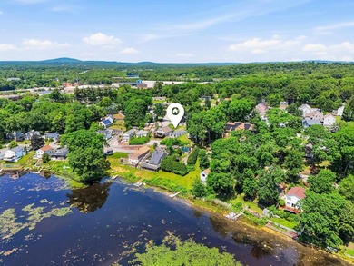 Wake up to sweeping views of Pine Island Pond from this charming - photo 29