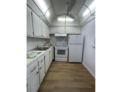 Enjoy active adult living in this desirable 1/1.5 waterfront - photo 2