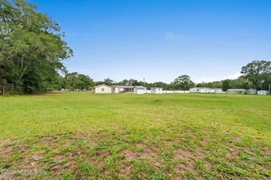 Rare opportunity to own 1.86 fully fenced acres in Jacksonville! - photo 12