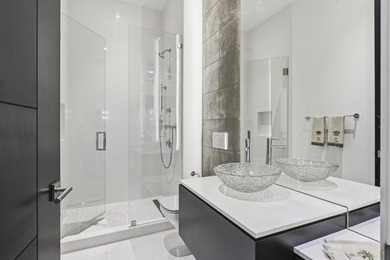 Built in 2020, this chic in-town home on the ocean block of