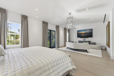 Built in 2020, this chic in-town home on the ocean block of