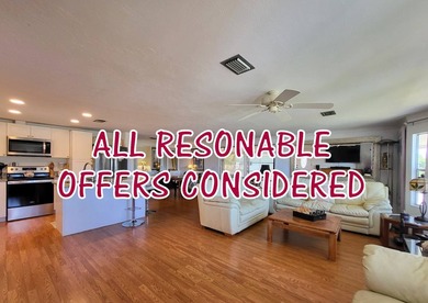 BEAUTIFUL RENOVATION IS TURNKEY AND INCLUDES GOLF CART! Just - photo 1