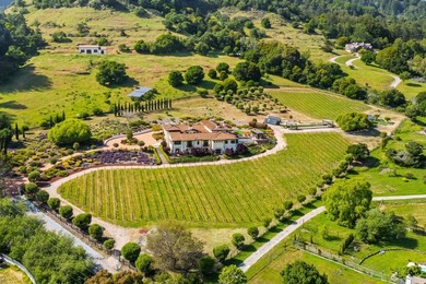 Nestled in a meadow & surrounded by over 21 acres of natural - photo 3